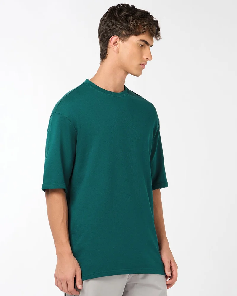 بيواكوف تيشيرت رجالي واسع بلون أخضر بحري داكن